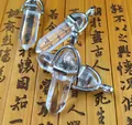Detailed view of four hexagonal clear crystal point pendants on vintage bamboo scroll - Clear White