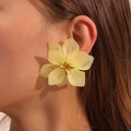 Matte translucent yellow acrylic flower earrings shown on a model for an elegant look - Light Yellow