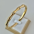 Bamboo style 18K gold plated stainless steel bracelet with cubic zirconia accents - Bamboo Design Gold Bangle