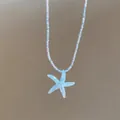 Macro detail of blue iridescent starfish pendant on a beaded beach necklace chain - Style 10-Blue (Iridized Starfish Tiny Bead)