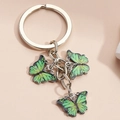 Metal keychain featuring three vibrant green butterfly pendants on a round ring - Yellow-Green