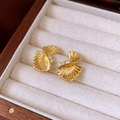 Macro detail of gold leaf earrings with sparkling zircons on soft velvet padding - Gold (925 Sterling Silver Earring Post)