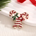 Broche navideño de esmalte con bastones de caramelo cruzados y lazos rojos y verdes - Br0009
