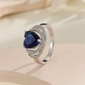 Elegant silver ring with heart-shaped blue gemstone and micro-pave zircon halo - US 7 / Silver Blue