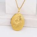 Gold oval locket necklace with vintage floral engraving on a white stone background - Oval Peach Blossom/Gold