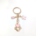 Rose gold baby theme keychain featuring pink enamel milk bottle and bodysuit charms - Style D / Pink