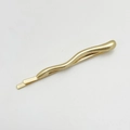 Detailed close-up of a wavy gold alloy hair clip with a polished finish and minimalist style - Single 3# / Matte Gold