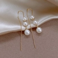 Elegant gold long tassel line earrings featuring triple white pearls in a vertical drop design - White Pearl Ear Threads