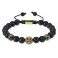 Macro detail of hand-woven beaded bracelet with matte black beads and gold zircon ball - African Turquoise Style
