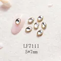 Strass d'ongles ovales à bordure dorée 5x7mm pour l'art de manucure japonais - Base Or Pierre Blanche (LF7111) / 5X7mm