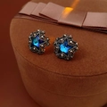 Vintage star-shaped earrings with dark blue crystal center in retro metal frames - Black Blue Star Style
