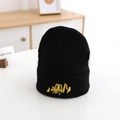 Close-up of yellow excavator embroidery on black knitted beanie for children - 52-54cm / Black