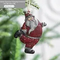 Vintage red metal Santa Claus ornament with white dots hanging on Christmas tree branch - Santa Claus A