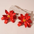 Detailed view of oversized red acrylic flower earrings with yellow beaded stamen center - Red