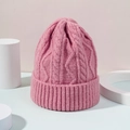 Close-up of pink cable-knit beanie featuring a thick ribbed cuff for winter warmth - M (56-58cm) / Deep Pink