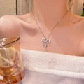 Silver bow pearl necklace featuring a luxury Saturn-style planet pendant for women - Saturn Pearl Design Element / Silver/Pearl Bowknot