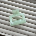 Detail view of light green marble rectangle hair claw clip on jewelry display tray - Green Small Square 5cm