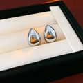 Macro shot of polished silver water drop earrings displayed in a premium jewelry box - 925 Silver Needle Style / Silver