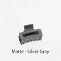 Close-up of matte silver gray hollow square hair claw clip with frosted texture - Matte Silver Gray