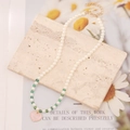 Detail of pearl necklace with green beads and pink heart pendant on stone base - 1# Green