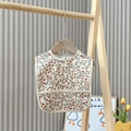 Waterproof baby bib with red and blue floral pattern on beige fabric with crumb catcher - Fun Floral 2