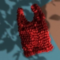Stretchable red bubble tote bag with unique pleated texture on a stylish artistic background - Red