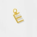 Macro detail of polished gold-plated letter E pendant on a high-quality metal necklace - Letter E / 925 Silver
