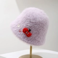 Detailed view of a soft purple plush bucket hat with decorative buttons - Purple