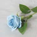 Single stem artificial blue velvet rose with gradient petals on soft white background - Light Blue