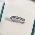 Elegant silver ring with seven light blue cabochon stones in a plush jewelry box - Seven Light Blue Cabochon Gemstones Style (白金色14)