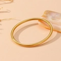 Detailed close-up of a polished gold stainless steel bracelet with buckle closure - Gold Smooth Round Style (S101)
