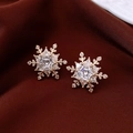 Detailed view of gold plated snowflake stud earrings featuring sparkling zircon stones - Gold (Real Gold Plated)
