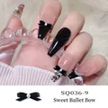 3D black ballet bow nail charm with pearl inlay on sweet balletcore style nails - Black Ballet Streamer