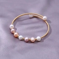 Ethnic handmade wire-wrapped bracelet with colorful pearls on purple silk fabric - Multicolor Pearl Gold Bangle