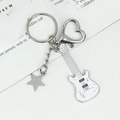 White guitar keychain with musical note and star pendant featuring heart lobster clasp - New Mini Guitar (White with Star)