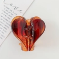 Translucent amber heart hair claw clip for women made of elegant polished resin - Caramel color