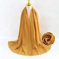 Golden yellow bubble pearl chiffon scarf shown on a mannequin with texture detail - Gold Yellow
