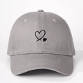 Detailed close-up of gray cotton baseball cap featuring black heart embroidery and twill texture - One Size / Gray