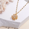 Elegant gold-plated titanium necklace with rotating clover pendant and sparkling zircon stones - Rotating White