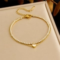 Detail of gold-plated double-layer stainless steel bracelet with heart-shaped zircon charms - Heart Zircon Layered Style (B1746)