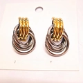 Elegant gold and silver interlaced triple ring stud earrings on a jewelry card - 15x24 Two-Tone Style