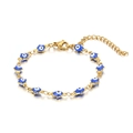 Detail of 18K gold-plated link bracelet featuring multiple blue Evil Eye enamel charms - Blue