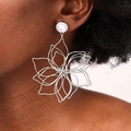 Statement silver layered wire flower earrings with pearls shown on model profile - Silver - Pearl Stud Style