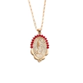 Detailed macro of gold Virgin Mary pendant featuring a halo of radiant red crystals - Gold Virgin Mary (Red Zirconia)