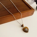 Detail of silver ball chain with heart resin pendant and cross flower engraving - Necklace-Brown-Heart(Tiger Eye)