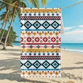 Microfiber beach towel with geometric pattern hanging in a tropical seaside setting - B98-Bohemian Geometric Print