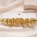 20-piece set of gold geometric rings with smooth, twisted, and beaded designs on white satin - Silver Needle-Gold (Twenty-Piece Set)
