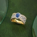 Macro shot of 18K gold ring with emerald-cut sapphire and intricate lace engraving - Adjustable Open / Blue Rhinestone
