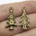 Antieke bronzen kerstboomhangers van metaal met voor- en achterkant op de vinger - Antiek Brons