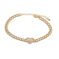 Adjustable golden heart and star zircon bracelet with elegant Figaro chain on white background - Heart